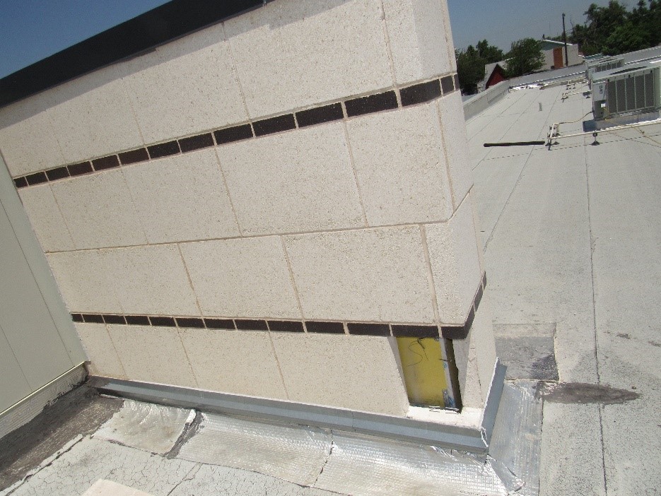 Intrusive testing for Insufficient Moisture Management Behind Stone-Clad Wall